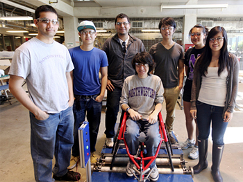 Students in Design Thinking and Communication (formerly Engineering Design and Communication) show off their project, a treadmill for wheelchair athletes