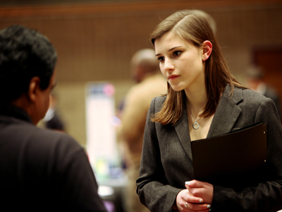 A student talks to a recruiter at a Northwestern career fair.