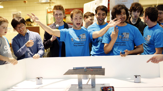 Students watch as their robots battle at the 2013 Design Competition.