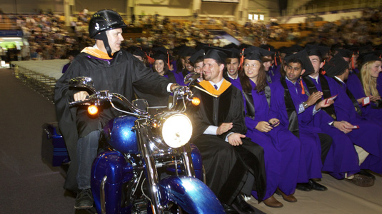President and chief operating officer of Harley-Davidson Motor Company Matt Levatich (MMM ’94) rides in during the McCormick undergraduate commencement on June 22.