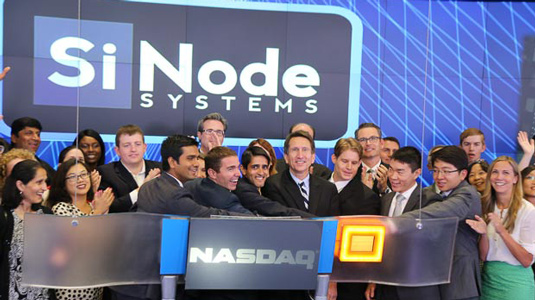 Members of the clean tech startup SiNode Systems ring the closing bell at NASDAQ on August 23.