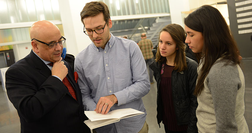 Northwestern students Brandon Williams, Steph Shapiro, and Olivia Ching explain their project to Dean Ottino.
