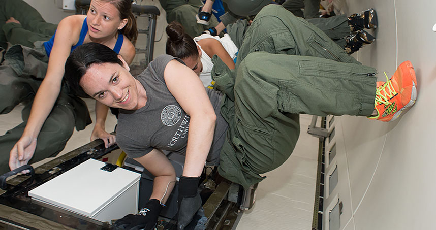 Undergraduates Kristen Scotti (foreground) and Emily Northard defy gravity during their first trip with NASA.