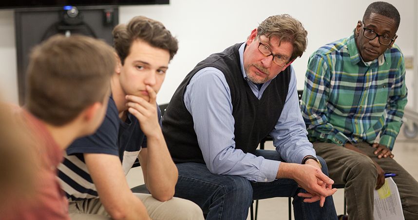 Instructors Joe Holtgreive and Byron Stewart listen to students during class discussion.