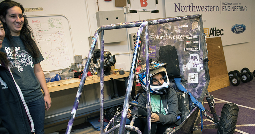 Members of Northwestern's Baja team tell participants about the process of building a car.