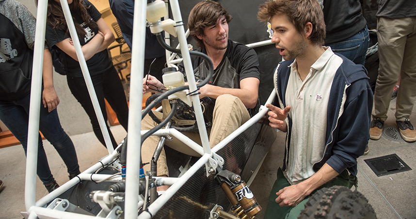 Students test out the Baja car at the April 26 unveiling.