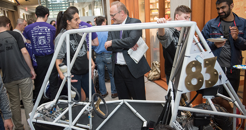 Undergraduate dean Wesley Burghardt mingles with students at the April 26 unveiling.