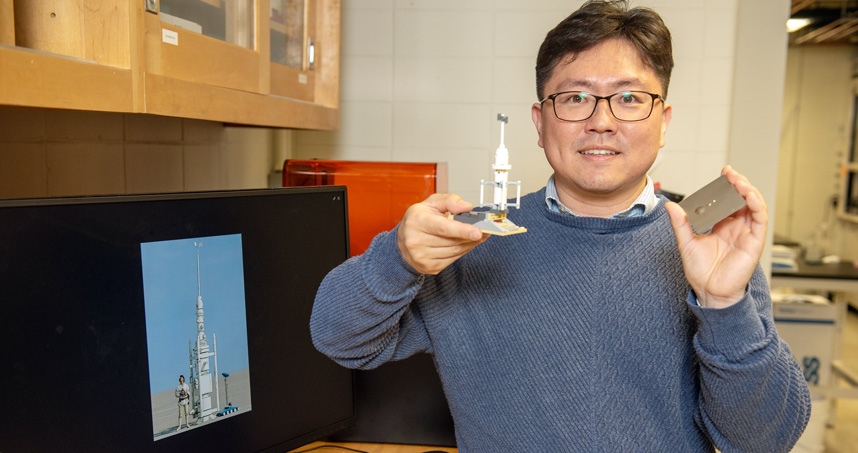 Ken Park holds a Lego model of a moisture vaporator from Star Wars, which inspired his research in fog harvesting.