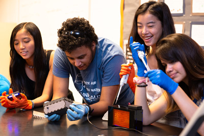 High school students use the BioBits educational kit.