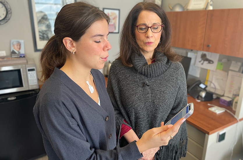 As Theresa Brancaccio watches, a singer uses the device to monitor the strain on her vocal cords.
