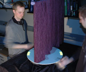Participants of the study could not see each other, but together moved a mark on the disk into a tar