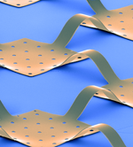 Thin metal wires connect the circuit element and buckle to handle the compression.