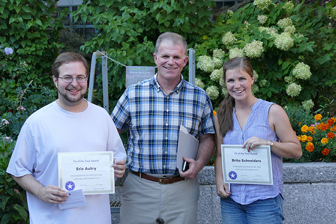 Eric Autry and Brita Schneiders pose for picture with ESAM Chair and Professor David Chopp