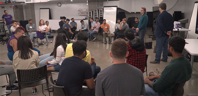 New students participate in a Second City workshop