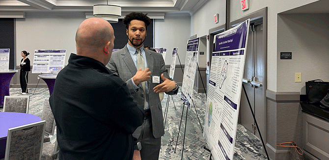 Matthew Williams presenting his poster