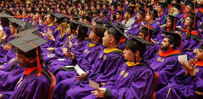 Graduates look on during the PhD Hooding and Master’s Degree Recognition Ceremony. | Photo by Joel Wintermantle