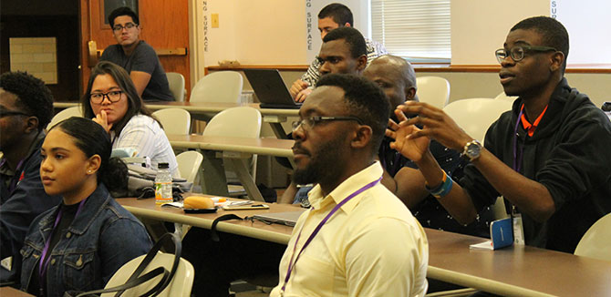 Audience members engage in discussion.