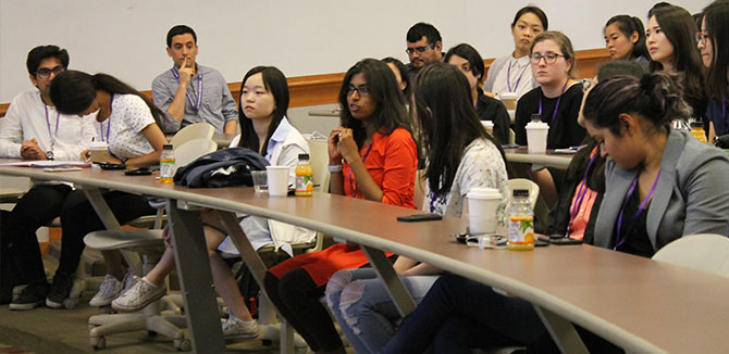 Audience members engage in discussion.