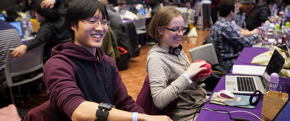 Two Computer Science students working together in class 