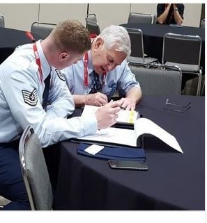 Program director Raymond Krizek with an Air Force Service Member