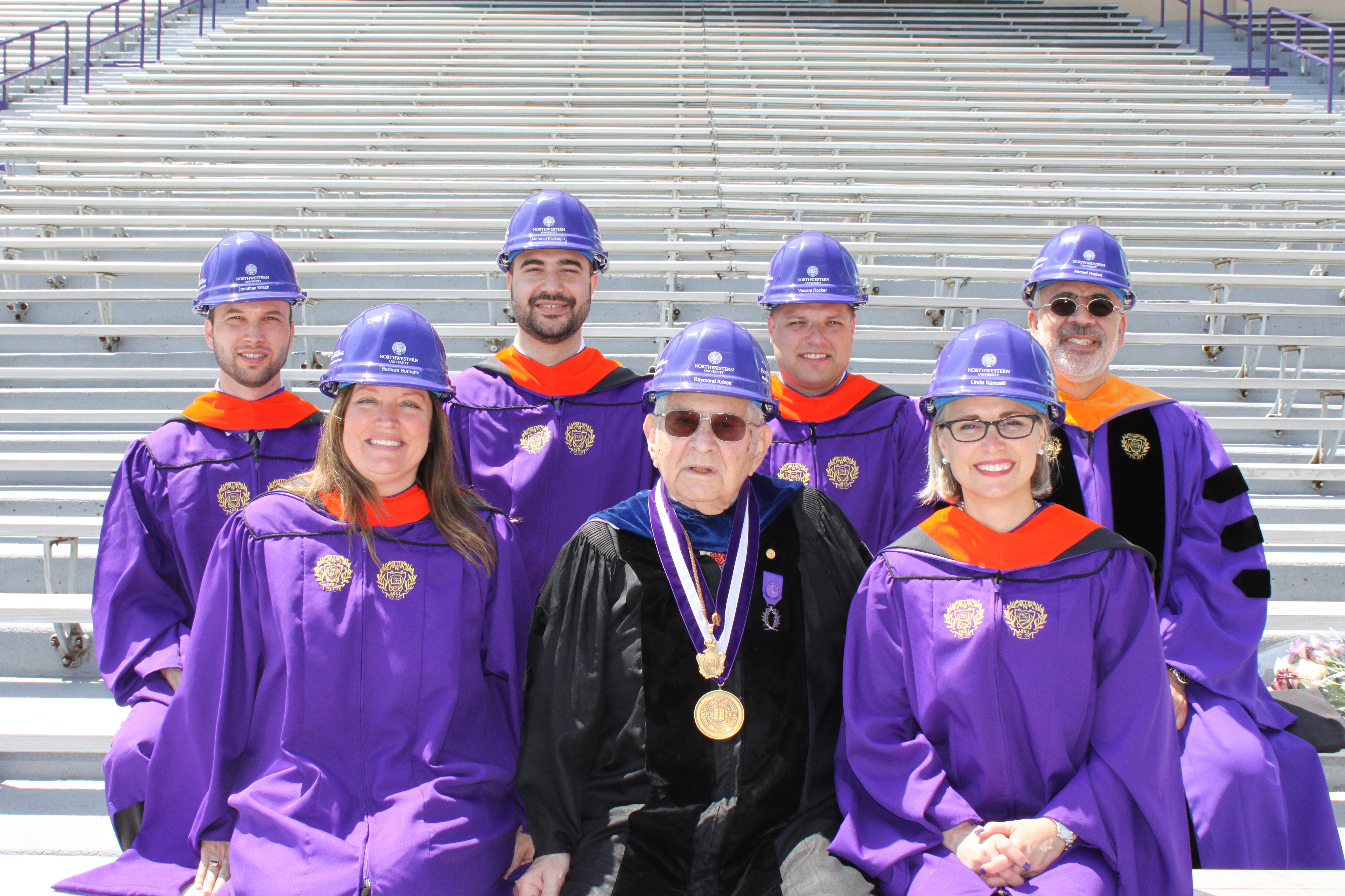 Professors Raymond Krizek (front row, center) and Ahmad Hadavi (back row, far right) pose with graduates of Northwestern Engineering's Master of Science in Executive Management for Design and Construction program.