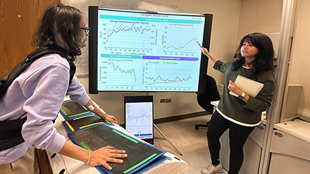 Researcher pointing at the sensor output on screen