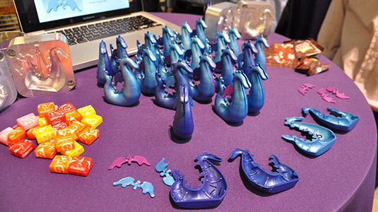 A dragon-shaped candy dispenser was one of the plastic toys McCormick students created for fourth-graders as part of the Computer-Integrated Manufacturing II: CAD/CAM course.
