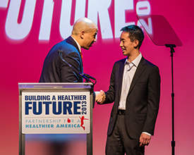 McCormick senior Dennis Ai is congratulated by Newark Mayor Corey Booker after winning the End Childhood Obesity Innovation Challenge.