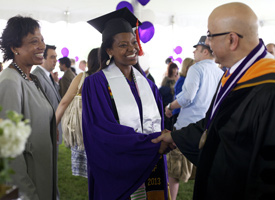 McCormick Dean Julio Ottino congratulates a graduating senior during the post-graduation reception on June 22.