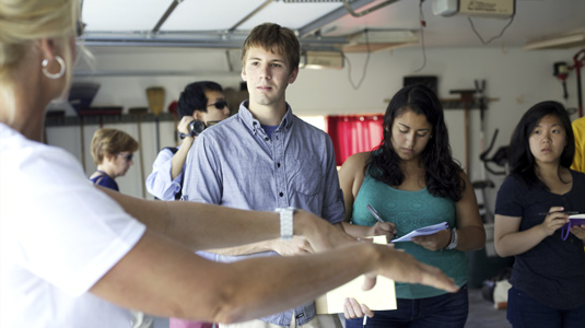 Design for America students tour flooded homes in the Chicago area.