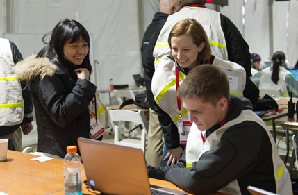 Karen Smilowitz works with students at the 2014 Bank of America Shamrock Shuffle 8K in March.