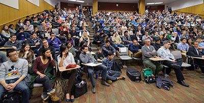 A standing-room-only audience listens to PayPal cofounder Peter Thiel.