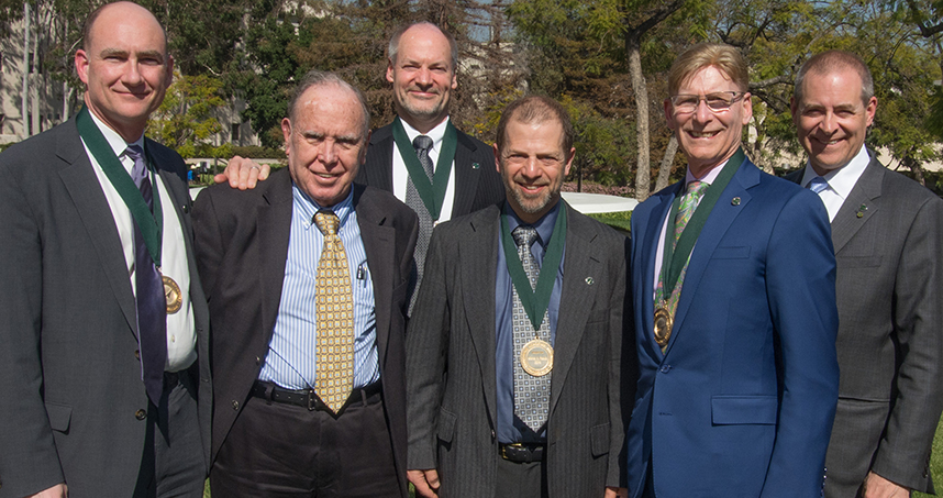 (Left to right): J. Edward Colgate, Colgate's father Sam Colgate, Joe Schimmels, Michael Peshkin, Richard Silverman, and James Conley. Schimmels is Peshkin's first graduate student, who is now a professor at Marquette.