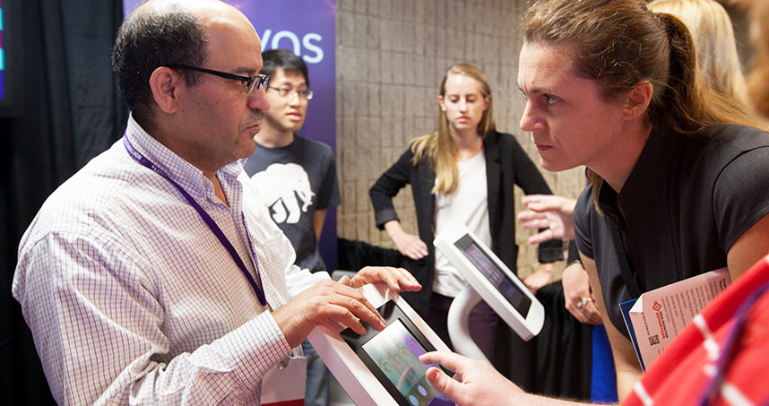 Mondher Cherif, chief scientist of Tanvas, explains the new haptics technology to conference guests.