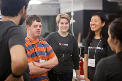 A client meets with team members working on a project to improve transportation for employees with Down Syndrome.