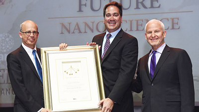 Chad Mirkin (center) accepts the 2016 Dan David Prize in the Future Time Dimension from Joseph Klafter (left), president of Tel Aviv University and chairman of the Dan David Prize Board of Directors. Northwestern President Morton Schapiro (right), also attended. Photo by Hadari Photography.