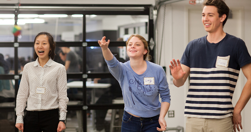 Emily Koller passes the "metaphor ball" as other students enjoy the exercise.
