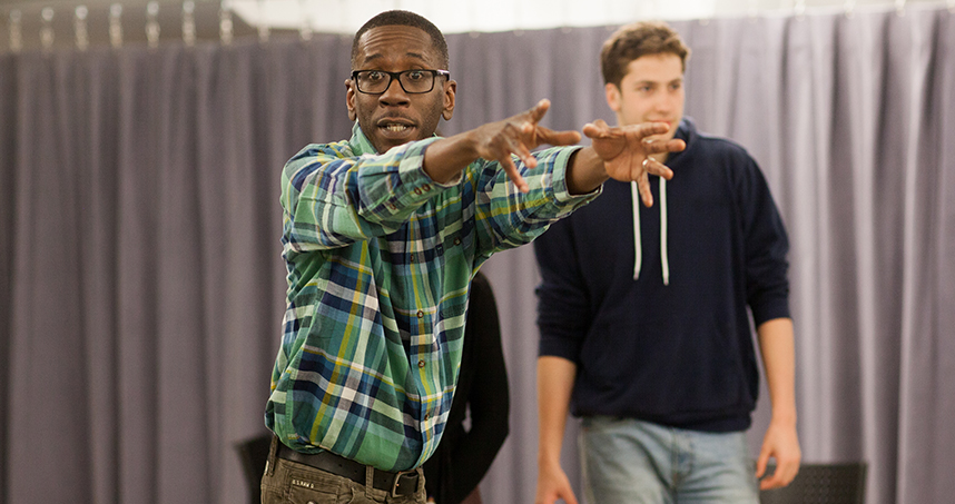 Lecturer Byron Stewart explains how to use the whole body when practicing improv warm-up activities.