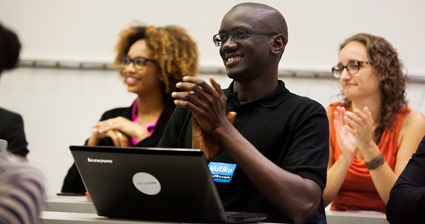 Kémo Touré Jr., from Senegal, applauds his classmates.