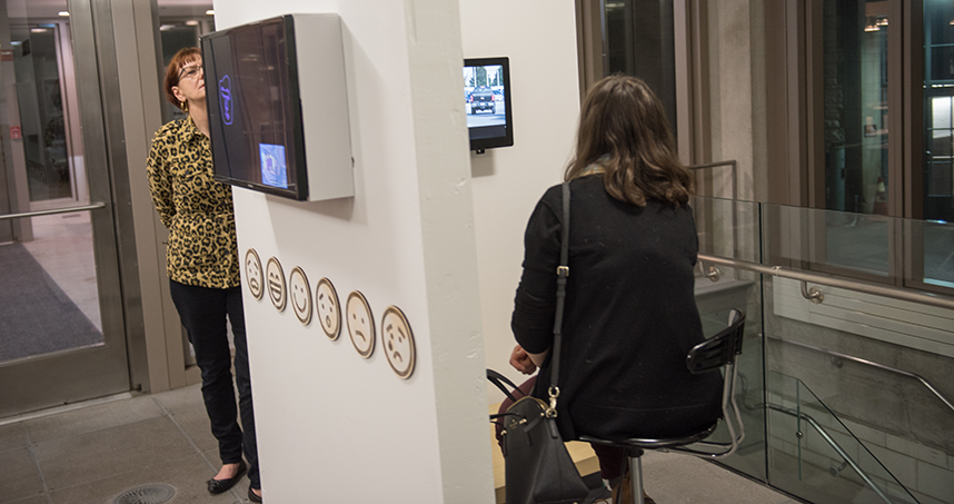 Visitors watch YouTube videos in the "React" installation.