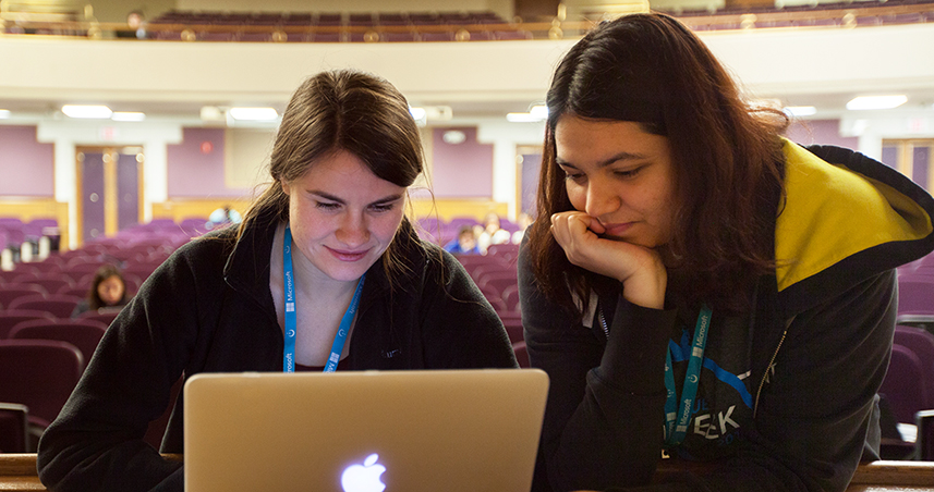 Women hack code at the first-ever BuildHer hackathon.