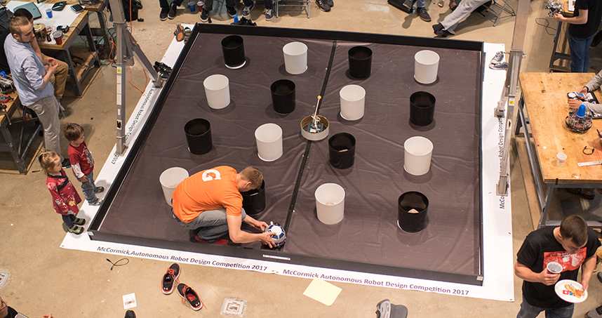 Set up in the Ford Shop, the competition arena included plastic pylons for the robots to hide behind.