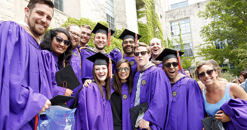 Graduates pose for a photo outside of Tech.