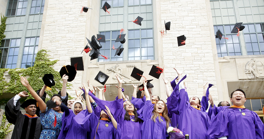 Outside of Tech, graduates toss their hats into the air after the ceremony.