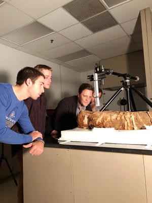 Northwestern students working in joint classics and material studies course investigate the mummy in Marc Walton’s lab.