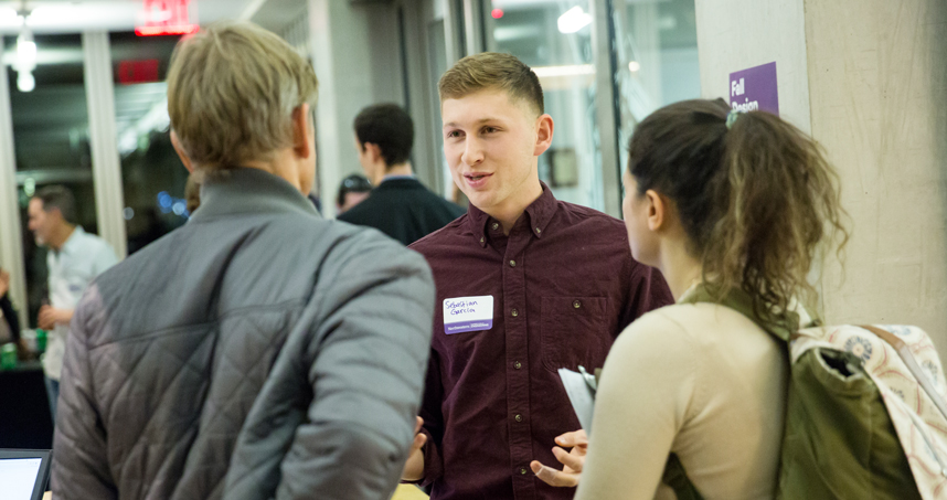 Sebastian Garcia, a senior studying design and computer science, shares his design portfolio at the Design Expo.
