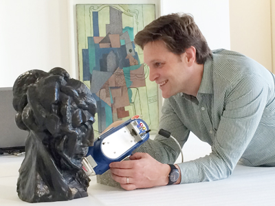 Marc Walton, Northwestern Engineering research professor and co-director of NU-ACCESS, uses portable equipment for elemental analysis of the alloy of Pablo Picasso, Tête de femme (Fernande), Paris, automne 1909, bronze, Musée national Picasso – Paris, (C) RMN-Grand Palais (Musée national Picasso-Paris), (C) Succession Picasso 2018