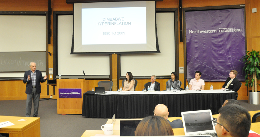 Dennis Chookaszian (left) leads a discussion on Bitcoin and blockchain.