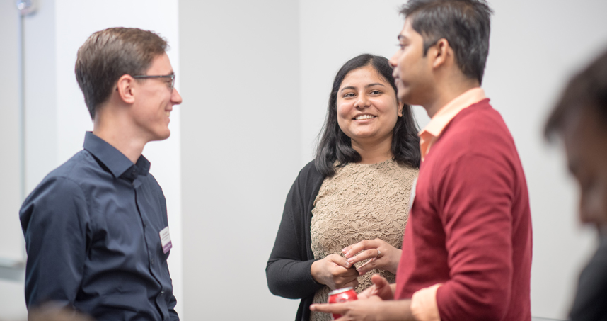 Lukas Justen (left) and Jaieu Sheil talk to a classmate during MSAI's orientation.