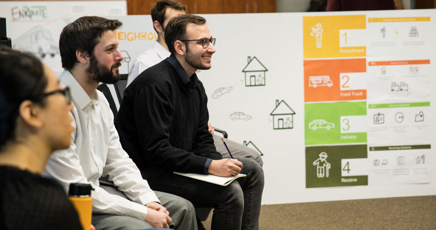 Members of the group that created NeighbourFood meet with Feeding America representatives to discuss their ideas.